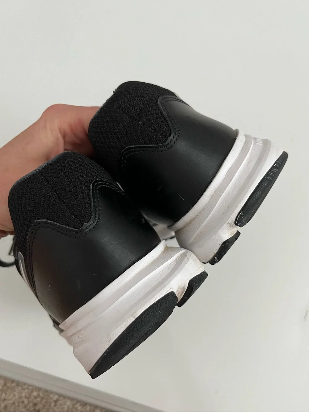 Nike Men’s Black Running Shoes with White Swoosh